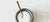 Jodsalz in einem runden Gefaess mit einem Löffel auf einem Marmortisch